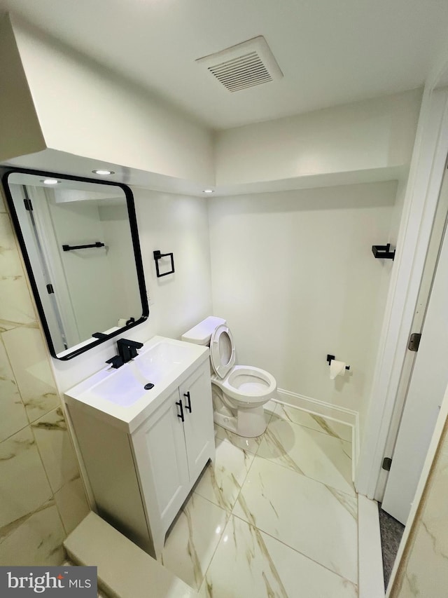 6610 N Smedley St, Philadelphia, PA 19126 - bathroom featuring marble look tiles and vanity