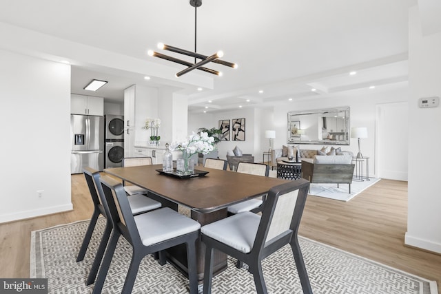 205 Yoakum Pkwy Unit 1712, Alexandria, VA 22304 - dining room with stacked washer / dryer, light wood finished floors, a chandelier, and recessed lighting