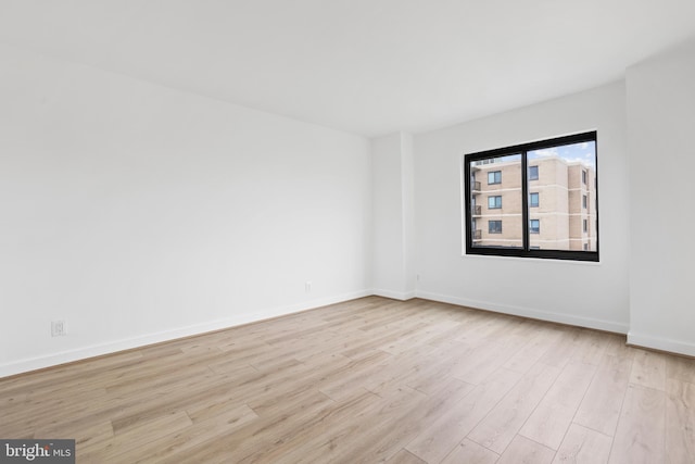 205 Yoakum Pkwy Unit 1712, Alexandria, VA 22304 - unfurnished room with light wood-type flooring and baseboards