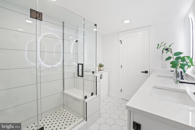 205 Yoakum Pkwy Unit 1712, Alexandria, VA 22304 - bathroom with double vanity, a shower stall, recessed lighting, and tile patterned floors