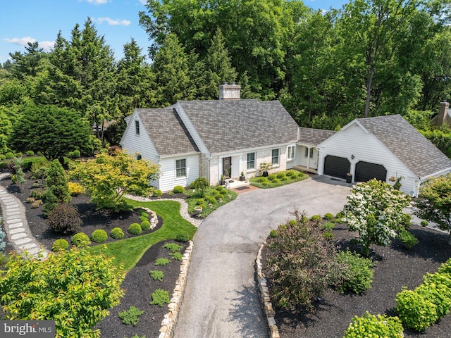 4704 Sweetbriar Cir, Emmaus, PA 18049 - cape cod house featuring driveway, an outdoor structure, a garage, and a chimney