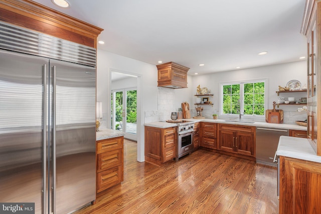 4704 Sweetbriar Cir, Emmaus, PA 18049 - kitchen with high quality appliances, healthy amount of natural light, brown cabinets, and recessed lighting
