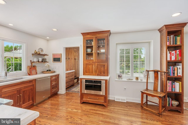 4704 Sweetbriar Cir, Emmaus, PA 18049 - kitchen with stainless steel appliances, open shelves, light wood-style floors, light countertops, and recessed lighting