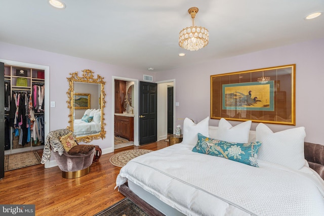 4704 Sweetbriar Cir, Emmaus, PA 18049 - bedroom featuring a chandelier, a spacious closet, wood finished floors, recessed lighting, and a closet