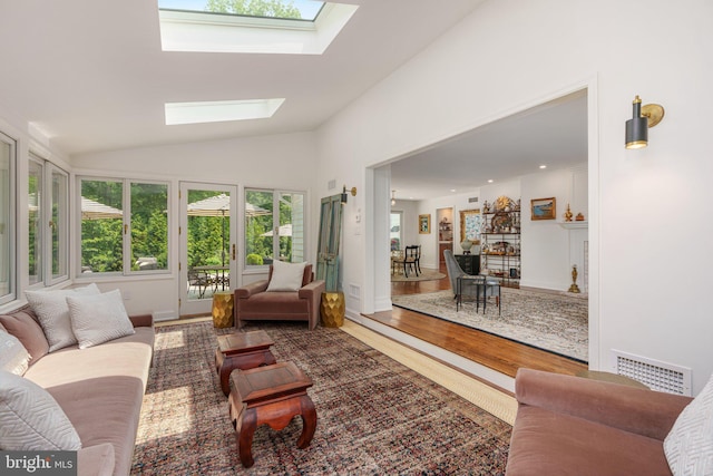 4704 Sweetbriar Cir, Emmaus, PA 18049 - living room featuring a skylight, lofted ceiling, and wood finished floors