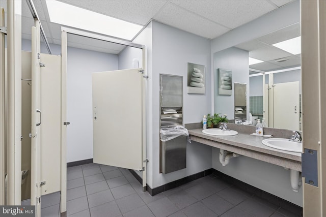 119 S Easton Rd, Glenside, PA 19038 - bathroom with a paneled ceiling, tile patterned floors, double vanity, and a shower