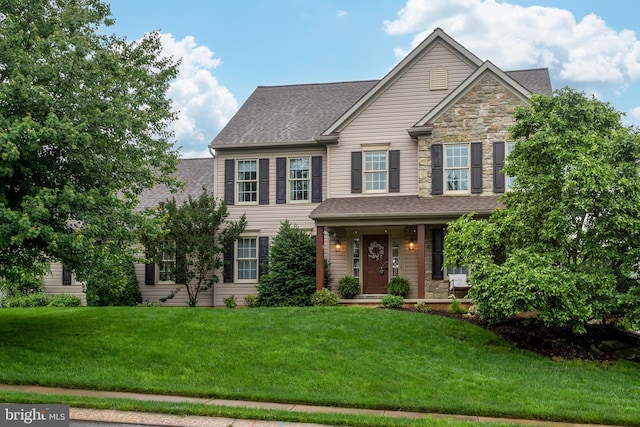 1817 Old Farm Ln, Lancaster, PA 17602 - view of front of house featuring a front yard, roof with shingles, and stone siding