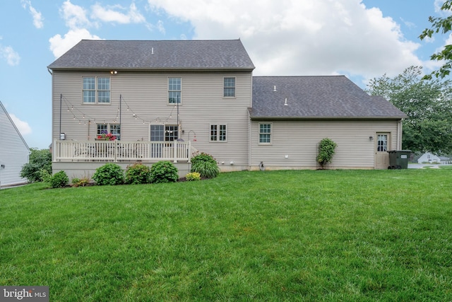 1817 Old Farm Ln, Lancaster, PA 17602 - rear view of property featuring a lawn, a shingled roof, and a wooden deck