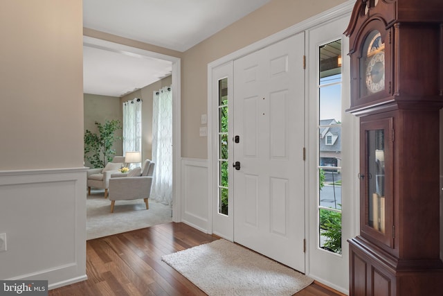 1817 Old Farm Ln, Lancaster, PA 17602 - foyer entrance featuring dark wood-style floors, wainscoting, and a decorative wall