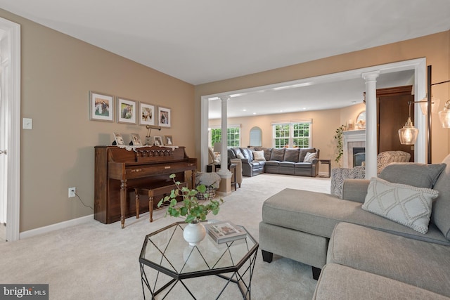 1817 Old Farm Ln, Lancaster, PA 17602 - living room with ornate columns, light colored carpet, and a fireplace