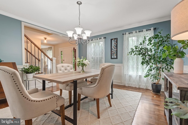 1817 Old Farm Ln, Lancaster, PA 17602 - dining room featuring stairway, a chandelier, wood finished floors, ornamental molding, and a wainscoted wall