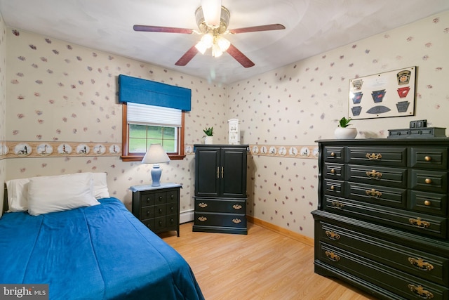 848 Rapp Rd, Howard, PA 16841 - bedroom with wallpapered walls, light wood-style flooring, a baseboard heating unit, and ceiling fan