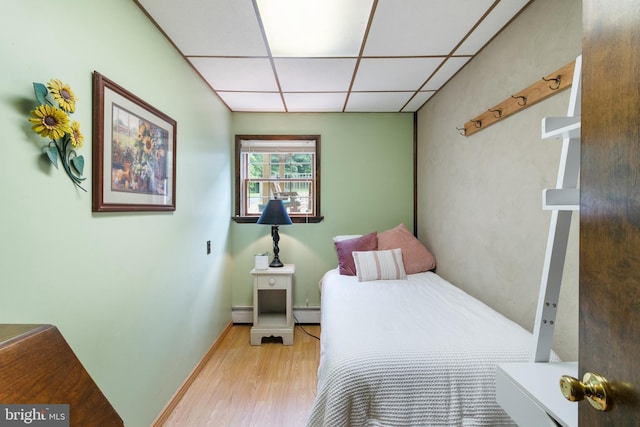 848 Rapp Rd, Howard, PA 16841 - bedroom with a drop ceiling, wood finished floors, a baseboard radiator, and baseboard heating
