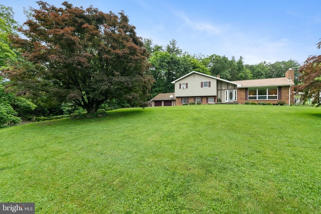 848 Rapp Rd, Howard, PA 16841 - view of front of home with a chimney, a front yard, and brick siding