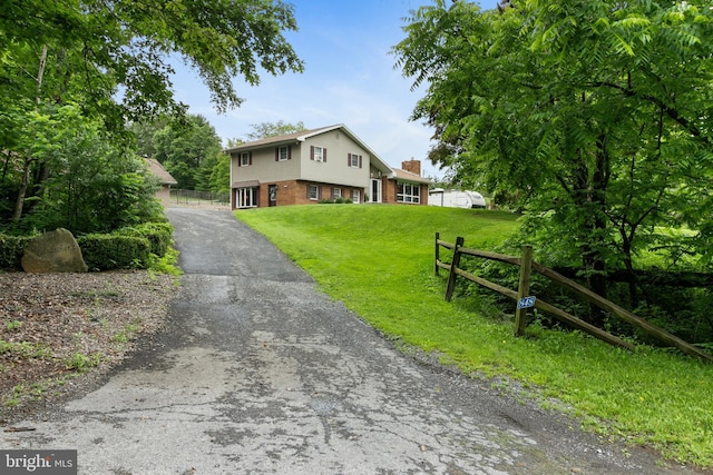 848 Rapp Rd, Howard, PA 16841 - view of front of property with brick siding, driveway, and a chimney