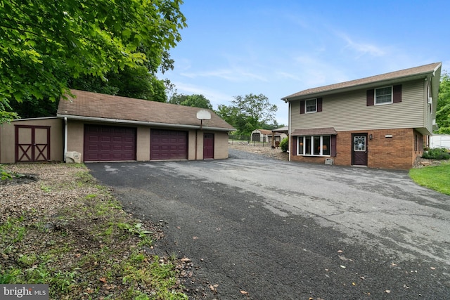 848 Rapp Rd, Howard, PA 16841 - view of side of home with an outbuilding, brick siding, and a garage
