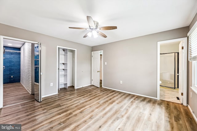 12 Bantry Ct, Waldorf, MD 20602 - unfurnished bedroom featuring wood finished floors, multiple closets, connected bathroom, and a ceiling fan