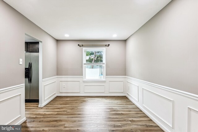 12 Bantry Ct, Waldorf, MD 20602 - unfurnished room with wood finished floors, a wainscoted wall, recessed lighting, and a decorative wall
