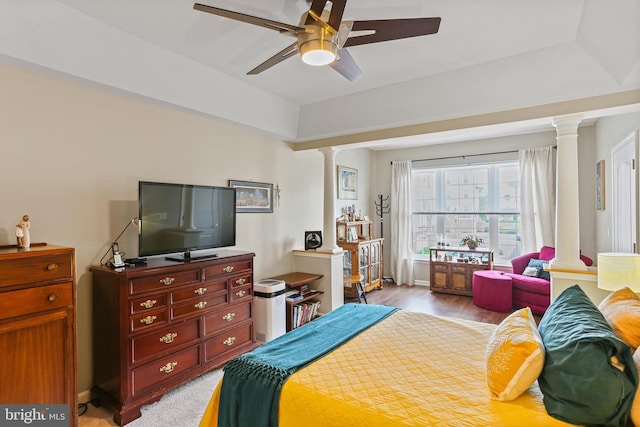 8608 Fluttering Leaf Trl Unit 208, Odenton, MD 21113 - bedroom featuring decorative columns, light wood-style floors, and a ceiling fan