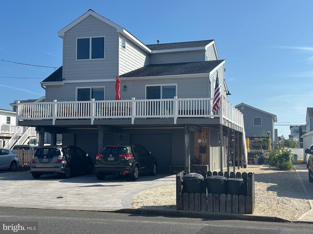 210 N 3rd St, Surf City, NJ 08008 - view of front facade with a carport and concrete driveway