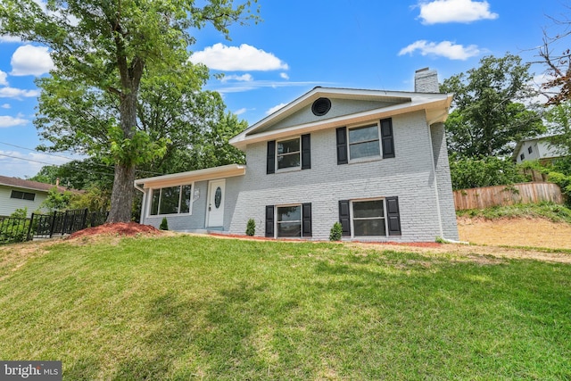 7306 Gavin St, Hyattsville, MD 20784 - split level home with a chimney and brick siding