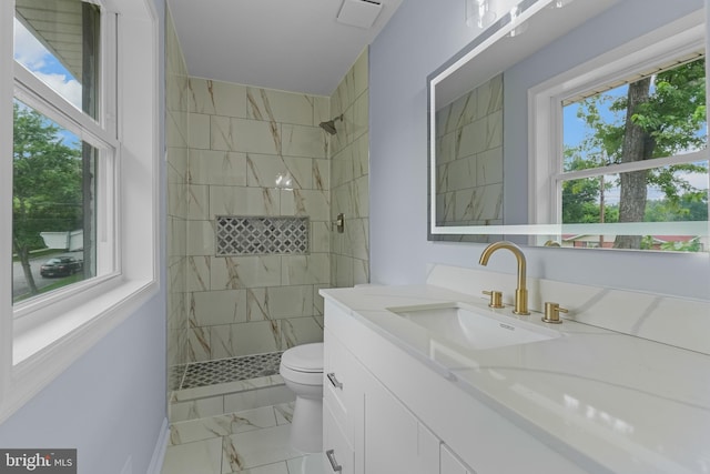 7306 Gavin St, Hyattsville, MD 20784 - bathroom with marble finish flooring, vanity, and tiled shower