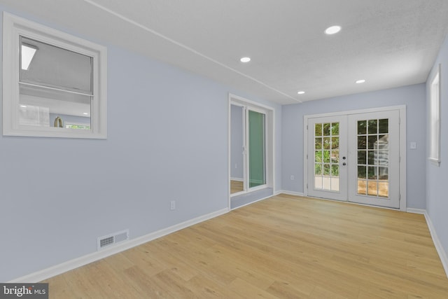 7306 Gavin St, Hyattsville, MD 20784 - empty room featuring french doors, wood finished floors, and recessed lighting