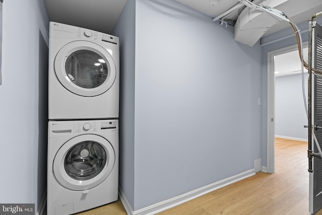 7306 Gavin St, Hyattsville, MD 20784 - laundry room featuring stacked washing machine and dryer and light wood-style floors