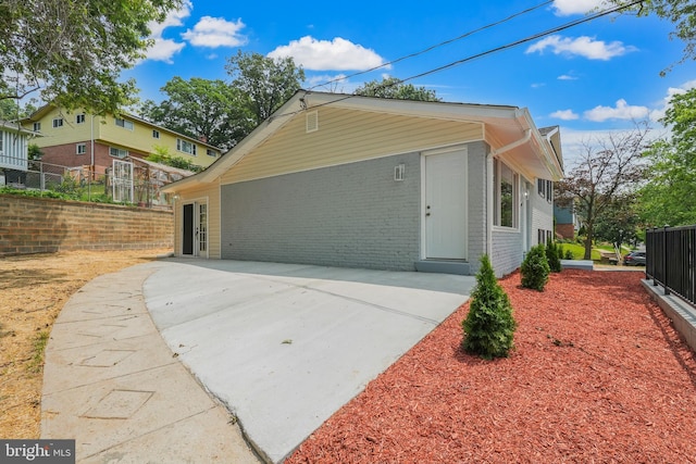 7306 Gavin St, Hyattsville, MD 20784 - view of home's exterior featuring brick siding and a patio