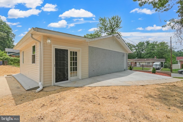 7306 Gavin St, Hyattsville, MD 20784 - view of property exterior featuring a patio and brick siding