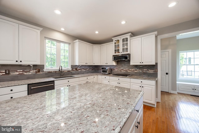 1568 Tattersall, West Chester, PA 19380 - kitchen featuring stainless steel appliances, backsplash, light stone countertops, white cabinetry, and recessed lighting