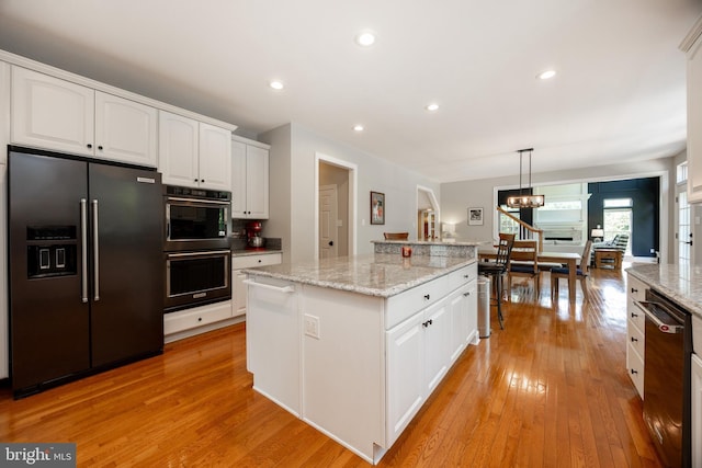 1568 Tattersall, West Chester, PA 19380 - kitchen with built in refrigerator, light wood-style flooring, white cabinets, and recessed lighting