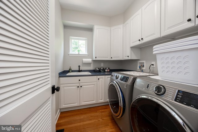 1568 Tattersall, West Chester, PA 19380 - laundry room featuring independent washer and dryer, light wood-style flooring, and cabinet space