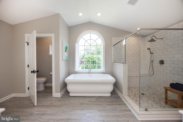 1568 Tattersall, West Chester, PA 19380 - full bathroom with lofted ceiling, a freestanding bath, a stall shower, and wood finished floors
