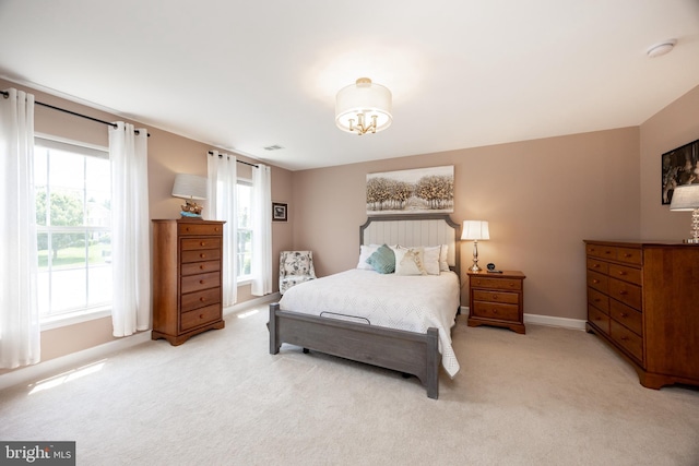 1568 Tattersall, West Chester, PA 19380 - bedroom featuring light colored carpet and a chandelier