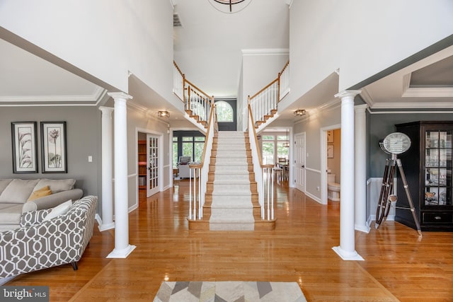1568 Tattersall, West Chester, PA 19380 - entryway with stairs, ornamental molding, decorative columns, a high ceiling, and wood finished floors