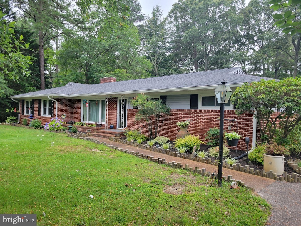 618 Pine Bluff Rd, Salisbury, MD 21801 - ranch-style home featuring brick siding, a front yard, and a chimney