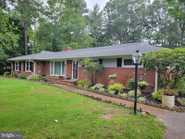 618 Pine Bluff Rd, Salisbury, MD 21801 - ranch-style home featuring brick siding, a front yard, and a chimney