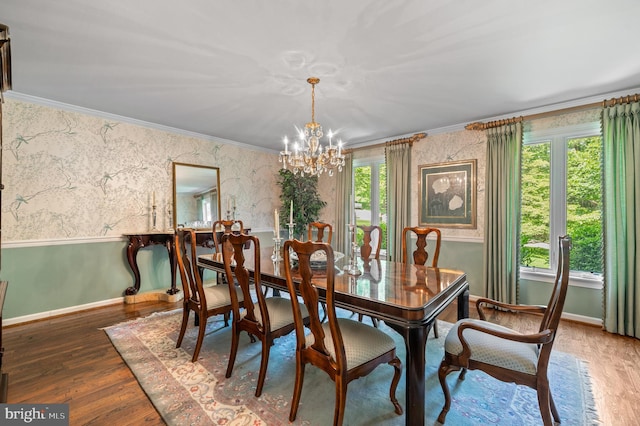 130 Hunt Valley Cir, Berwyn, PA 19312 - dining area featuring a chandelier, wood finished floors, wallpapered walls, ornamental molding, and wainscoting