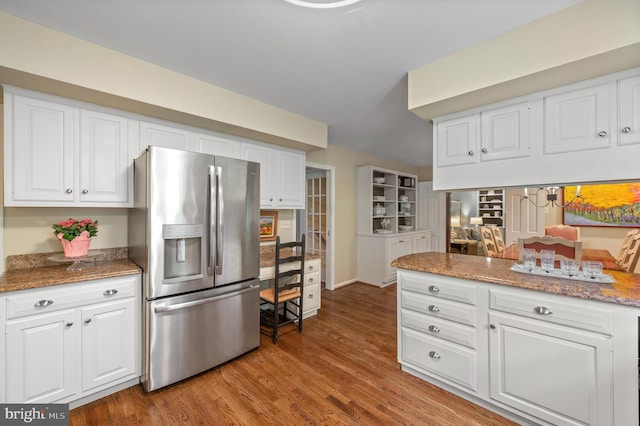 130 Hunt Valley Cir, Berwyn, PA 19312 - kitchen featuring stainless steel refrigerator with ice dispenser, white cabinetry, wood finished floors, and stone countertops