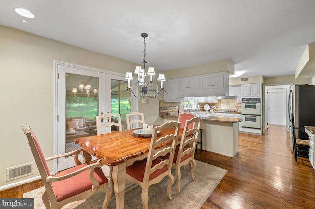 130 Hunt Valley Cir, Berwyn, PA 19312 - dining room with a chandelier and light wood-type flooring
