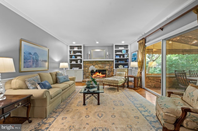 130 Hunt Valley Cir, Berwyn, PA 19312 - living room with ornamental molding, wood finished floors, built in features, and a stone fireplace