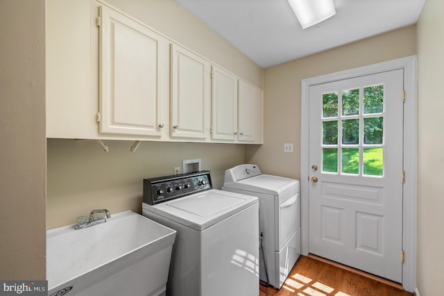 130 Hunt Valley Cir, Berwyn, PA 19312 - laundry room featuring cabinet space, washing machine and clothes dryer, and wood finished floors