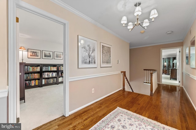 130 Hunt Valley Cir, Berwyn, PA 19312 - hall featuring an upstairs landing, a chandelier, ornamental molding, and wood finished floors