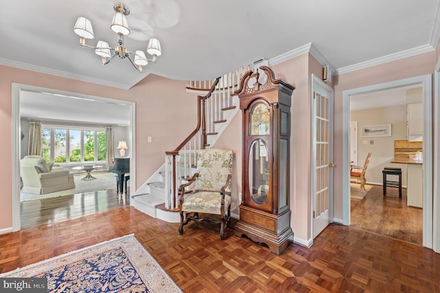 130 Hunt Valley Cir, Berwyn, PA 19312 - entryway with stairway, a chandelier, and crown molding