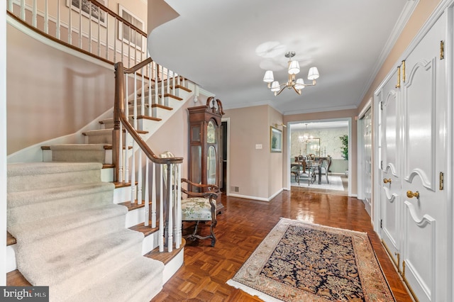 130 Hunt Valley Cir, Berwyn, PA 19312 - entrance foyer featuring a chandelier, stairway, and ornamental molding