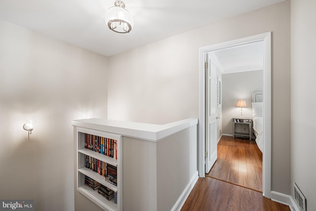 112 Oxley Ct, Newtown Square, PA 19073 - hall with wood finished floors, an upstairs landing, and a chandelier