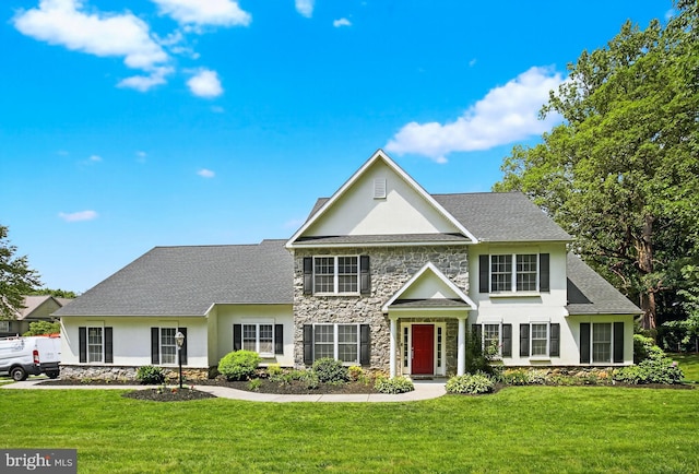 501 Bald Eagle Ct, Lancaster, PA 17601 - view of front of property featuring stone siding, stucco siding, a front yard, and a shingled roof