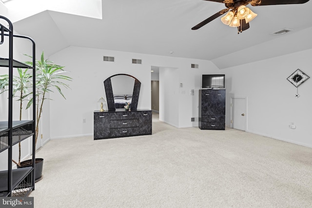 501 Bald Eagle Ct, Lancaster, PA 17601 - unfurnished living room featuring vaulted ceiling, a ceiling fan, carpet flooring, and a skylight