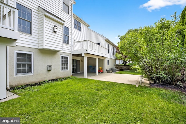501 Bald Eagle Ct, Lancaster, PA 17601 - back of house with a patio area, a lawn, a balcony, and stucco siding
